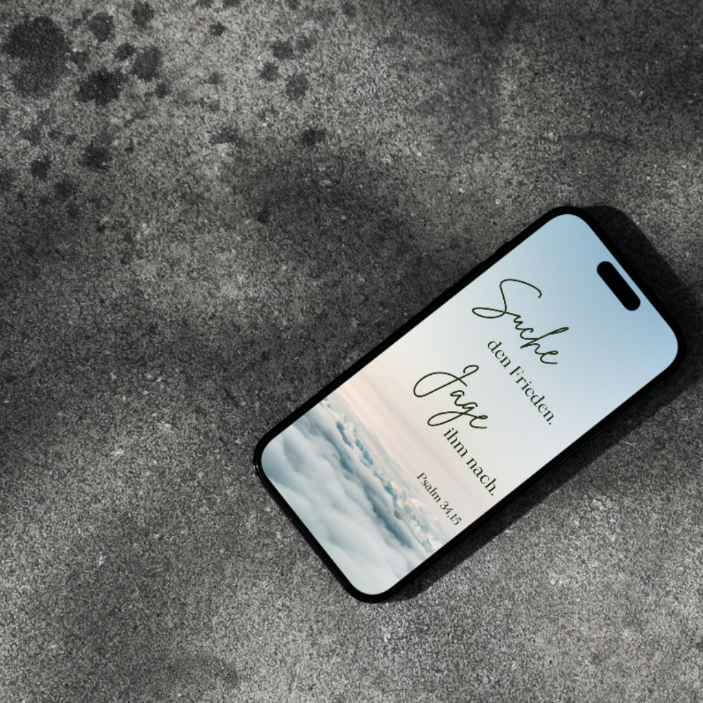 Smartphone mit Statusbild auf Boden